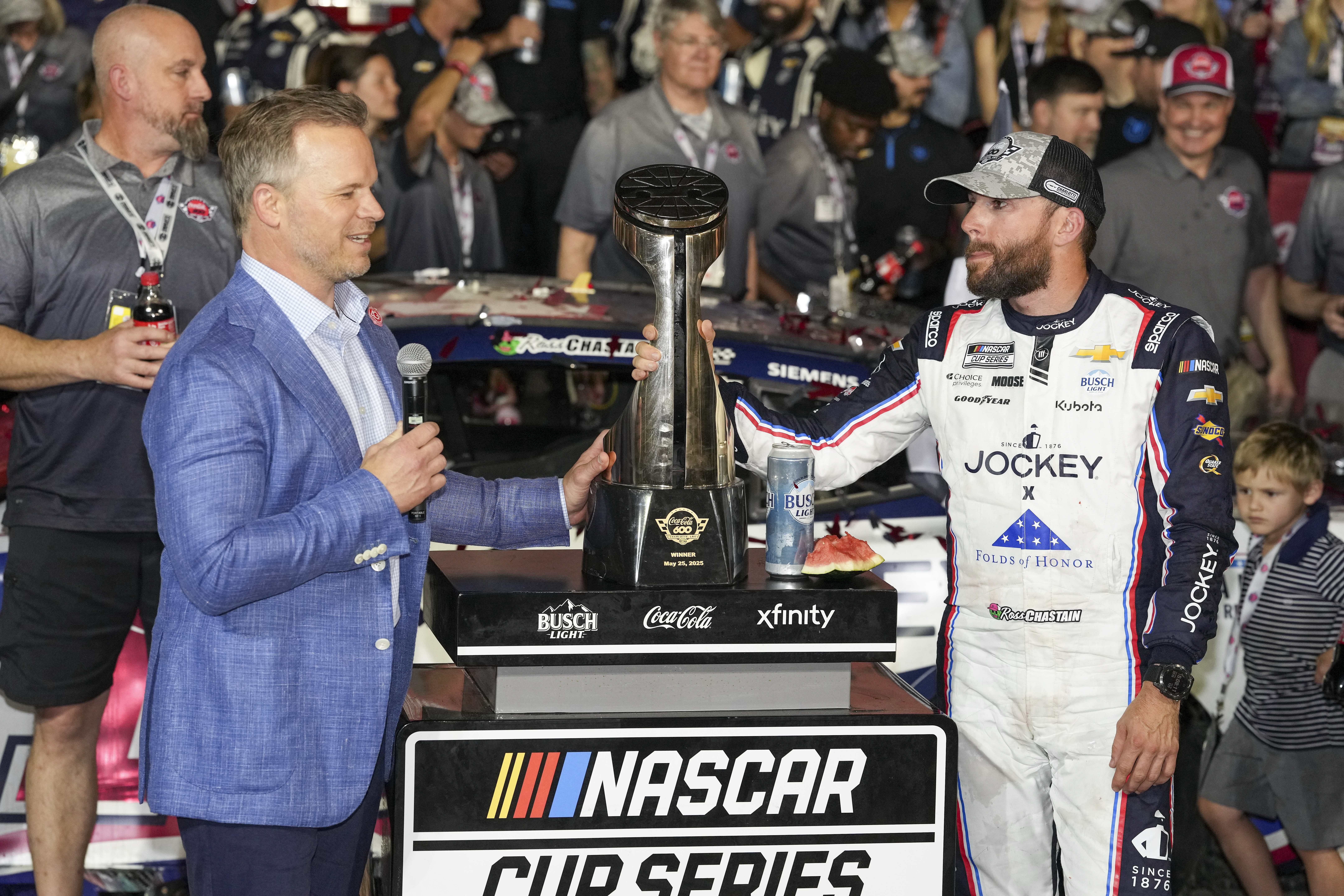 Ross Chastain (1) receives a ring and a watch from track president Marcus Smith. Source: Imagn